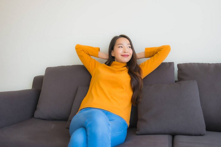 Portrait young asian woman happy relax smile on sofa chair with 