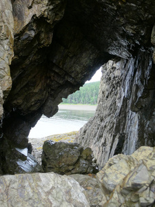 view from the rock grotto of the sea and the shore covered with 