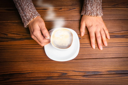 a female hands and coffee 