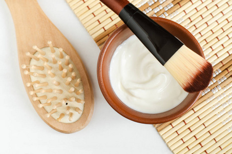 Homemade greek yogurt face and hair mask in the small brown bowl