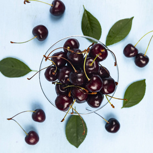 Ripe sweet cherry in a transparent bowl 