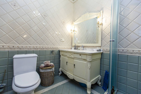 Spacious luxury bathroom with toilet, shower and washbasin. The 