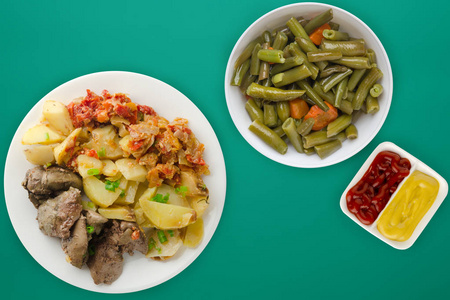  fried liver with potatoes and stewed tomatoes. fried liver on w