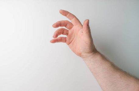 试图够到或抓住某物的人的左右手.投掷,触碰标志.我向左边伸出手.