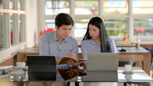 Close up view of businesspeople concentrating  on their work 