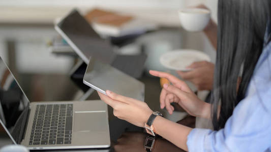 Cropped shot of businesspeople consulting on their project with 