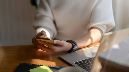 Cropped shot of college girl looking for an idea from smartphone