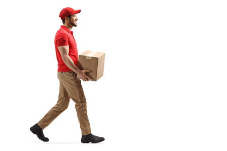 Delivery man carrying a package and walking 