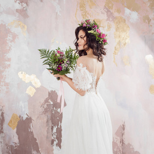 Elegant brunette girl bride with flowers. Beautiful young bride 