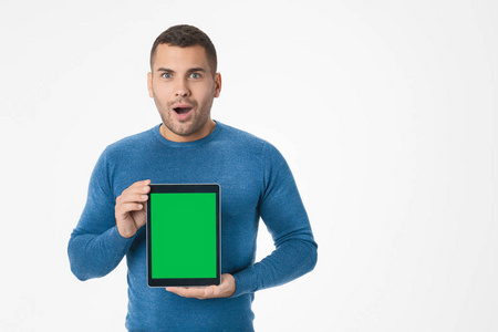 Emotional man showing digital tablet while being excited isolate