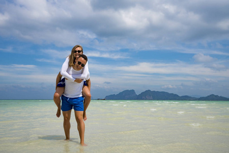 Happy couple in love on beach summer vacations. 