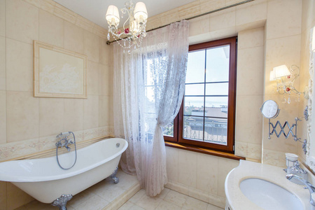 Elegant and rich Bathroom in a classic style in beige tones. Ele