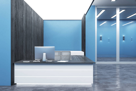 公司前台形象墙带电脑的现代蓝色前台.照片