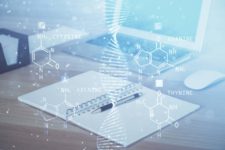 桌面电脑背景和DNA绘图。双重曝光。科学概念。
