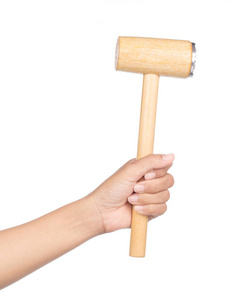 hand holding wood hammer with a rubber handle isolated on white 