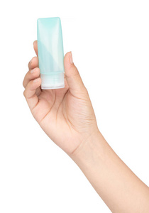 hand holding small plastic bottle of hygiene products  isolated 