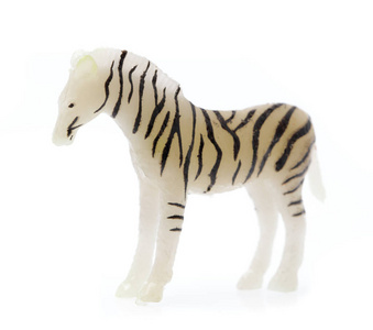 白色背景上隔离塑料制成的玩具斑马
