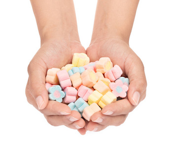 手拿着甜棉花糖,花形孤立的o照片