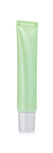 Green cosmetic tube isolated on a white background. 