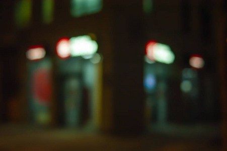 Bokeh signboards and shop windows. Blurred image of neon light i