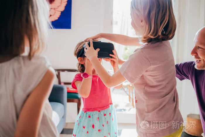 female children indoor using 3d viewer 