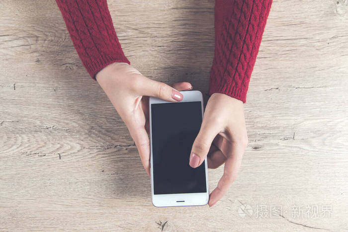  woman hand smart phone on desk