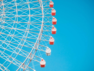 Ferris Wheel Over Blue Sky Background 