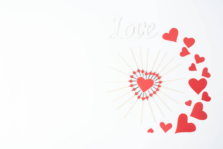 Red hearts on a white background, as the concept of alllovers d