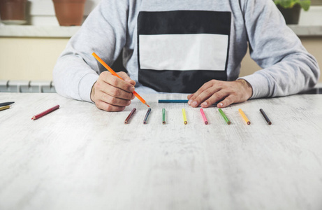 man hand color pencils 