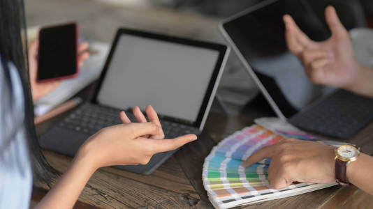 Cropped shot of young professional designer team choosing colour