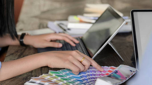 Cropped shot of young professional designer choosing colour for 