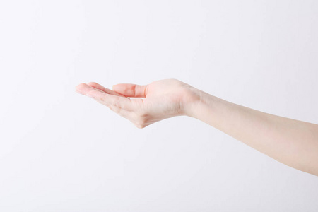 Empty female hand making gesture like holding something on white