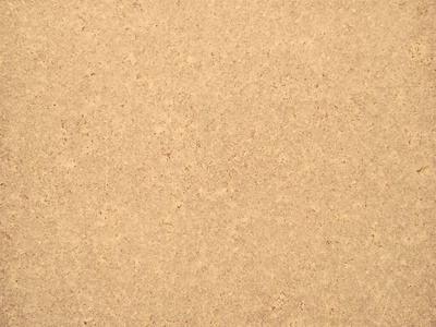 花岗岩呈黄褐色,有小的明暗斑点,不均匀的划痕.石头的质地.暖色调.