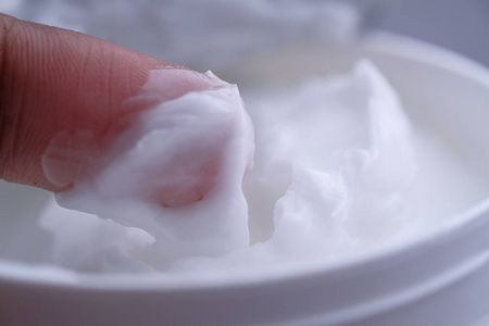 Close up of face cream in a container 