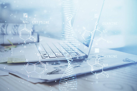 桌面电脑背景和DNA绘图。双重曝光。科学概念。
