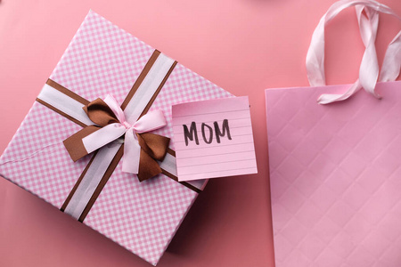 mother day concept with pink color gift on table 