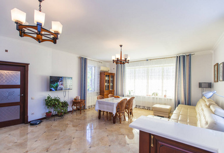 Classic bright living room with wooden furniture in the house. I