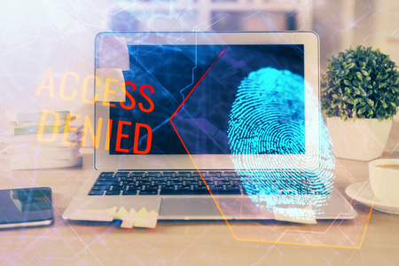 办公室桌面电脑，带指纹绘图。双重曝光。业务数据安全的概念。