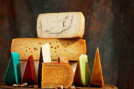 Elite variety of cheese on wooden background