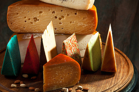 Elite variety of cheese on wooden background