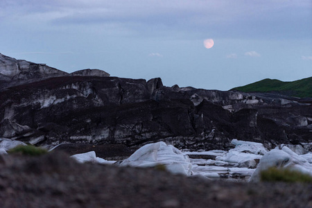 Beautiful night, Icelandic landscape with Glacier, ash and moon 