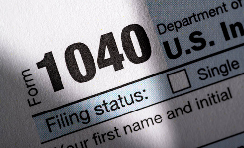 A stack of United States tax forms for individuals. 