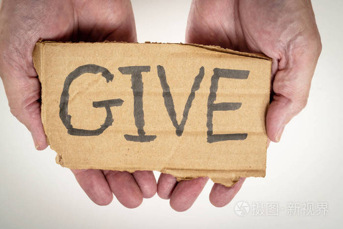 手掌上有给这个词的硬纸板标牌慷慨主题
