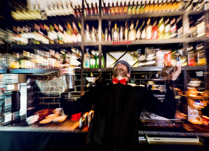 Bartender is making cocktail at bar counter. Fresh cocktails. 