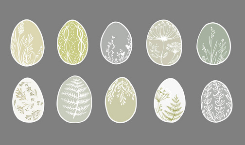 一套可爱的装饰复活节彩蛋孤立在灰色的背景