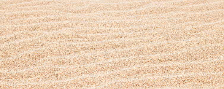 夏天沙滩上的沙子，质地为背景