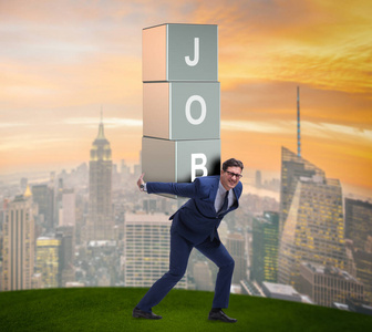 超载工作狂背负工作重担的商人照片