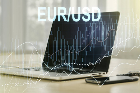 现代笔记本电脑背景下的欧元美元金融图表插图创意。贸易和货币概念。多次曝光
