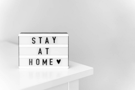 stay at home sign. covid-19 quarantine. introvert concept. 照片