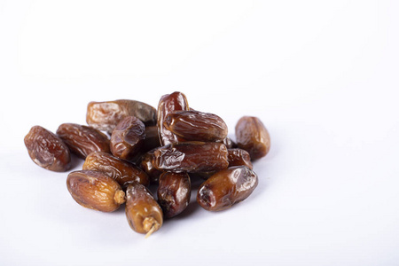 Oriental dates in the middle on white backdrop. 